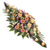warm and vibrant casket spray Sheffield funeral flowers